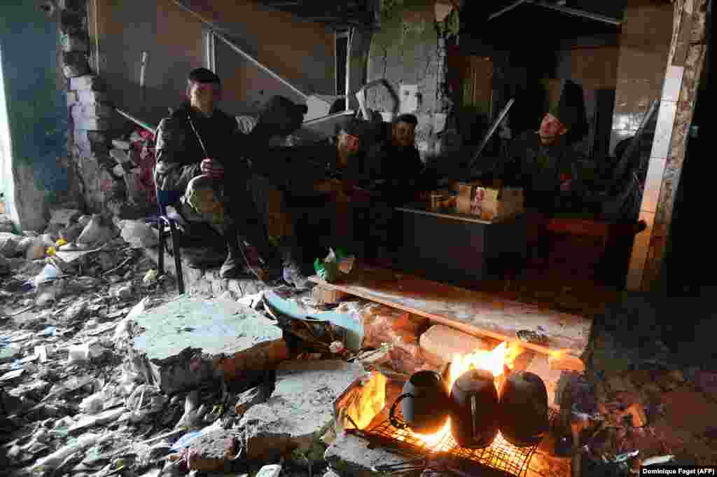 Russian-backed separatists are seen inside the remains of the Donetsk airport amid the second battle for the airport in October 2014. In September 2014, separatist forces launched an attack on Ukrainian troops holed up inside the facility. The airport was the only remaining foothold Kyiv had in Donetsk after the eastern city had been taken over by pro-Kremlin forces. 