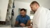 Banja Luka, Bosnia and Herzegovina -- A cardiologist looking at a laptop with his assistant 