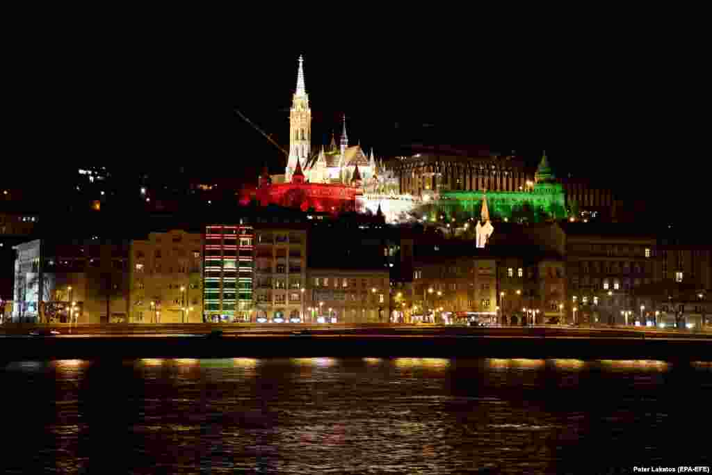 The Fisherman's Bastion at Buda Castle is illuminated with Hungary's national colors to commemorate the 175th anniversary of the outbreak of the 1848 revolution and war of independence against Habsburg rule in Budapest.