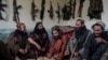 -- Taliban fighters enjoy lunch inside an adobe house that is used as a makeshift checkpoint in Wardak province, Afghanistan, Thursday June 22, 2023.Daily Life