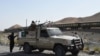 FILE: Pakistani soldiers near the site of a bomb attack on a train in Balochistan.