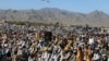 د جمعیت علمای اسلام (ف) پلویان په واڼه کې د یوې جلسې پر مهال د ګوند بیرغ رپوي - پخوانی انځور.