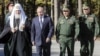 Патриарх РПЦ Кирилл, президент России Владимир Путин, министр обороны РФ Сергей Шойгу и начальник Генштаба ВС РФ Валерий Герасимов (слева направо) во время закладки камня в фундамент главного храма Вооруженных сил России. Московская область, 19 сентября 2018 года 