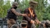 FILE: Afghan soldiers taking away alleged Islamic State (IS) fighters after they are presented to media in the eastern city of Jalalabad in May.