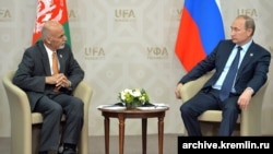 FILE: Russian President Vladimir Putin with the Afghan President Ashraf Ghani in July 2015.