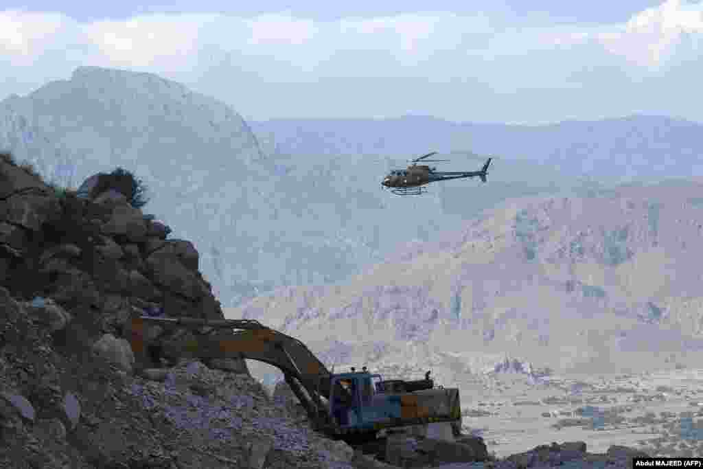 A military helicopter takes part in a rescue search for miners on September 8, a day after the mine collapsed. 
