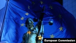 Belgium - The headquarters of the European Commission, EU Flag and Justice Statue, undated