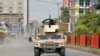 An Afghan Army vehicle patrols near the site of an attack on a jail compound in the eastern city of Jalalabad.
