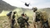 FILE: U.S. soldiers prepare to board a helicopter after Operation Deliberate Strike some 60 kilometers north of Kandahar.
