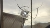 Armenia - A bullet hole on a window glass in a house in the village of Khnatsakh, March 31, 2025.