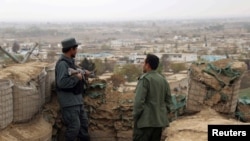Afghan police keep watch on the outskirts of Kunduz. (file photo)