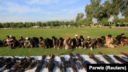 IS militants who surrendered to the Afghan government were shown to journalists in Jalalabad on November 17.