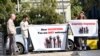 Участники пикета встречали гостей форума плакатами