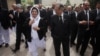 FILE: Pakistani Chief Justice Mian Saqib Nisar (R) speaks with Justice Mussarat Hilali while visiting the High Court in Peshawar.