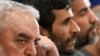Iranian Conservative politician, Habibollah Asgaroladi (L) and Mahmoud Ahmadinejad